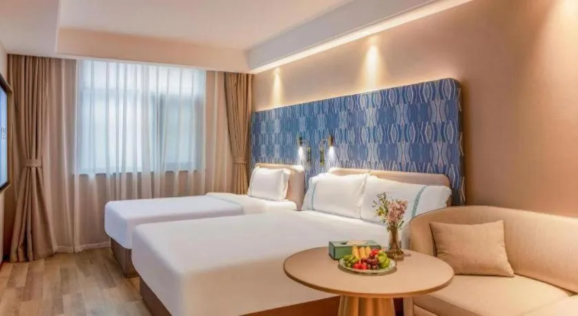 Bed in Xana Hotelle Beijing Olympic Park South Lishuiqiao Metro Station