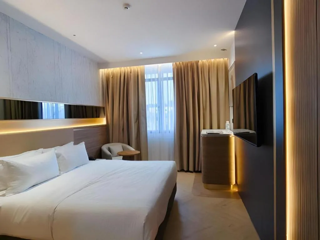 Bed in Grand City Hotel