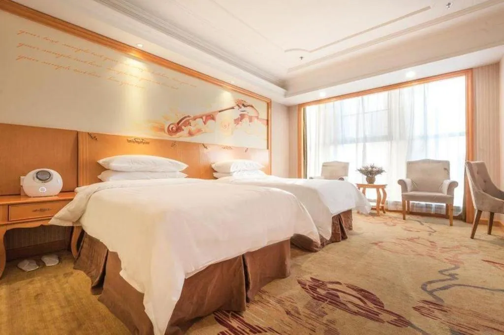 Bed in Vienna International Hotel Kunming Guangfu Road Aegean Shopping Center