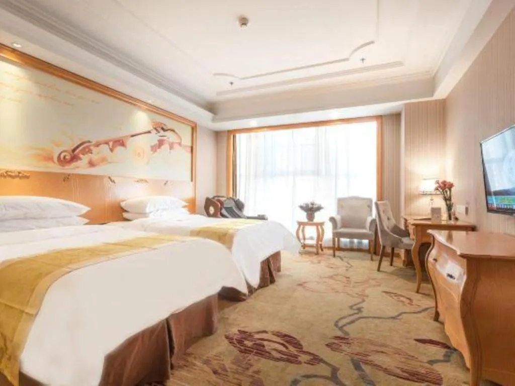 Bed in Vienna International Hotel Kunming Guangfu Road Aegean Shopping Center