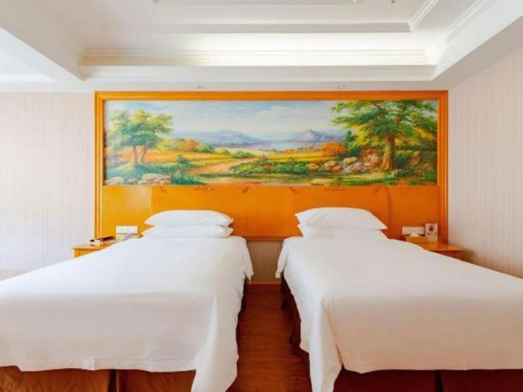 Bed in Vienna International Hotel Kunming Guangfu Road Aegean Shopping Center