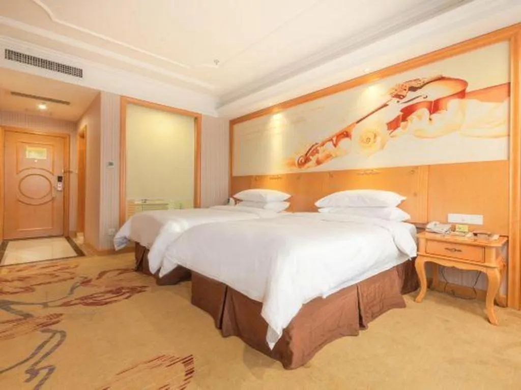 Bed in Vienna International Hotel Kunming Guangfu Road Aegean Shopping Center