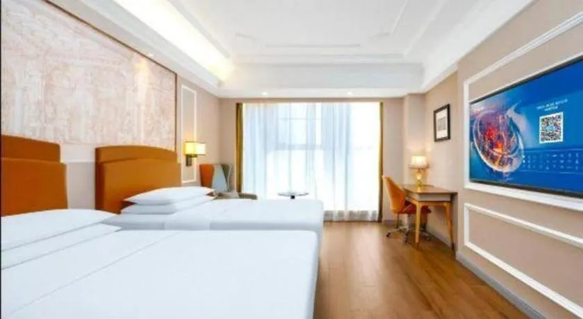 Bed in Vienna International Hotel Kunming Guangfu Road Aegean Shopping Center