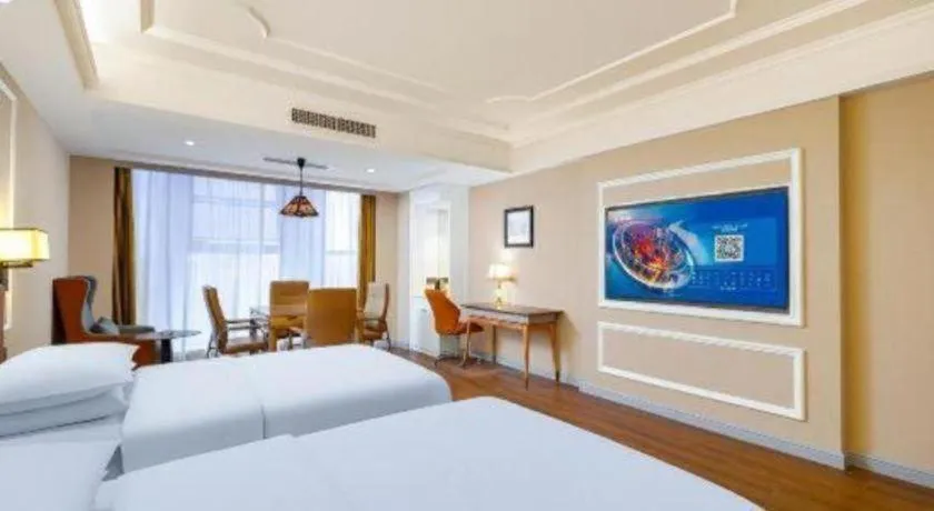 Bed in Vienna International Hotel Kunming Guangfu Road Aegean Shopping Center