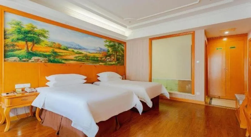 Bed in Vienna International Hotel Kunming Guangfu Road Aegean Shopping Center