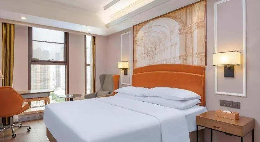 Bed in Vienna International Hotel Kunming Guangfu Road Aegean Shopping Center