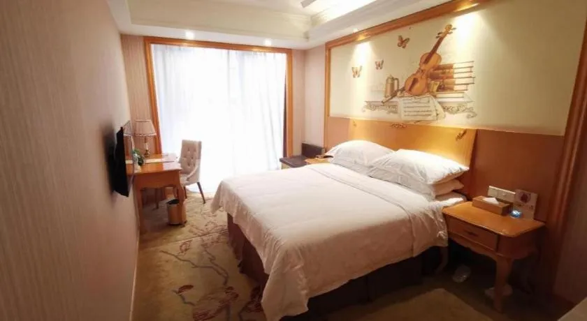 Bed in Vienna International Hotel Kunming Guangfu Road Aegean Shopping Center