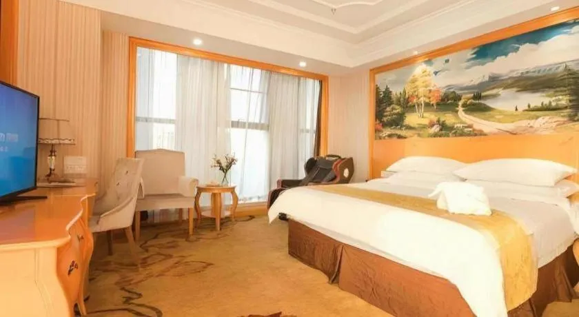 Bed in Vienna International Hotel Kunming Guangfu Road Aegean Shopping Center