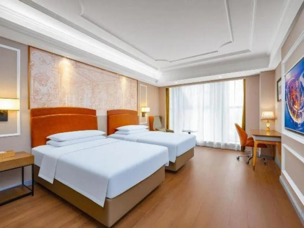 Bed in Vienna International Hotel Kunming Guangfu Road Aegean Shopping Center