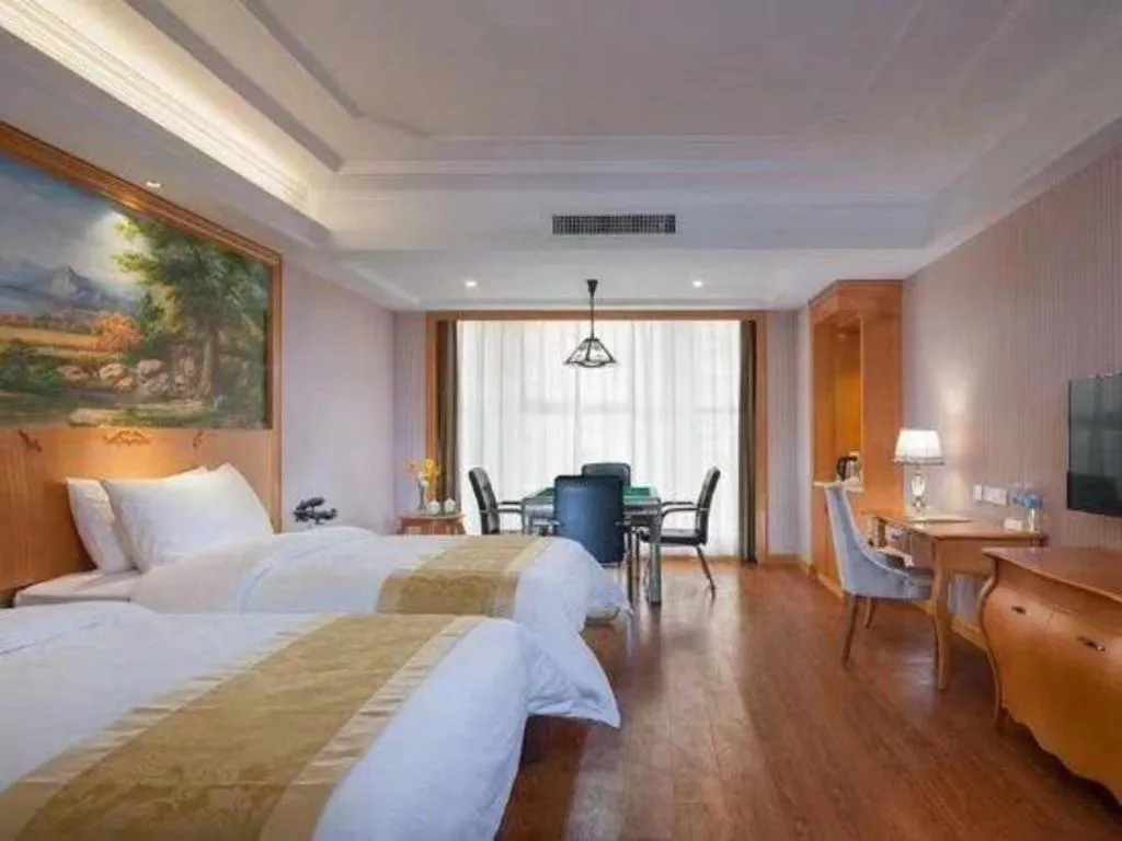 Bed in Vienna International Hotel Kunming Guangfu Road Aegean Shopping Center