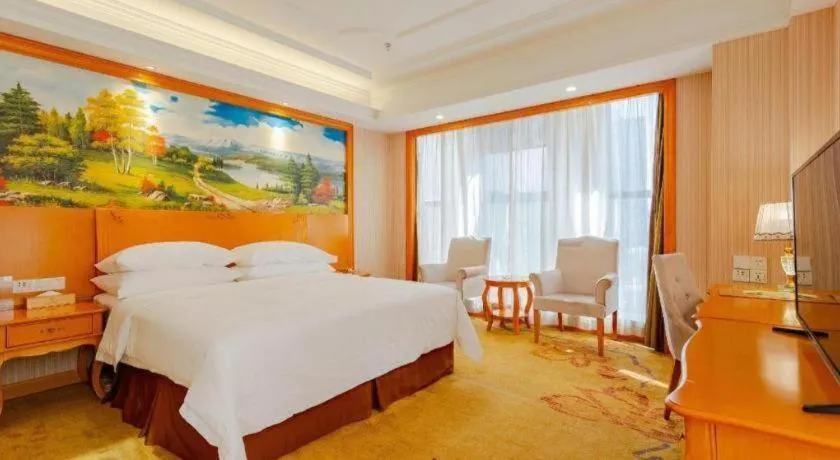 Bed in Vienna International Hotel Kunming Guangfu Road Aegean Shopping Center
