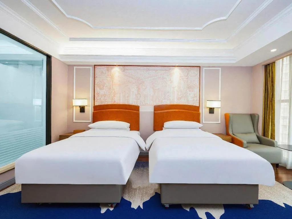Bed in Vienna International Hotel Kunming Guangfu Road Aegean Shopping Center