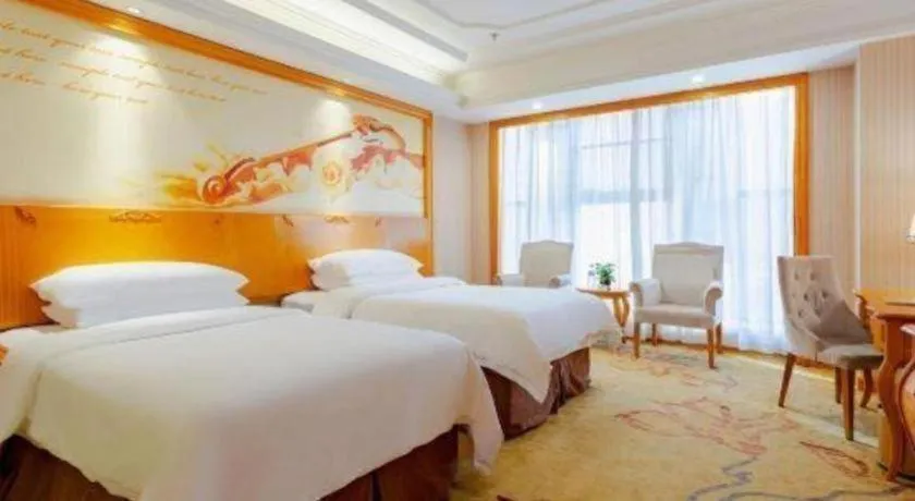 Bed in Vienna International Hotel Kunming Guangfu Road Aegean Shopping Center