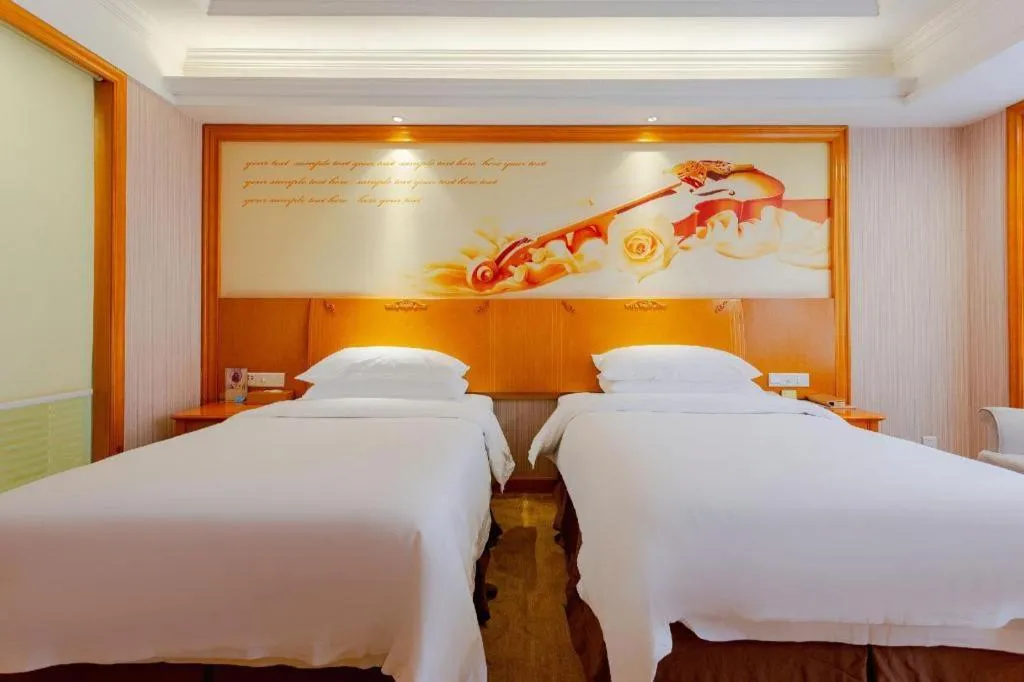 Bed in Vienna International Hotel Kunming Guangfu Road Aegean Shopping Center
