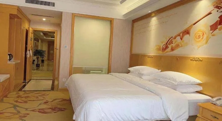 Bed in Vienna International Hotel Kunming Guangfu Road Aegean Shopping Center