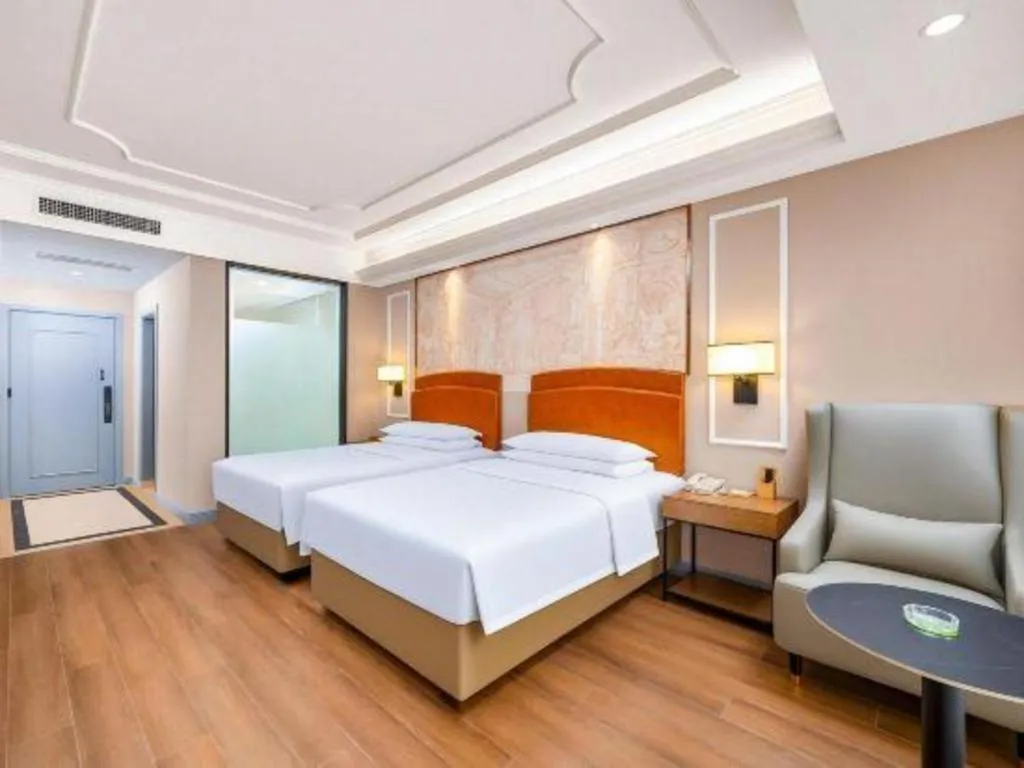 Bed in Vienna International Hotel Kunming Guangfu Road Aegean Shopping Center
