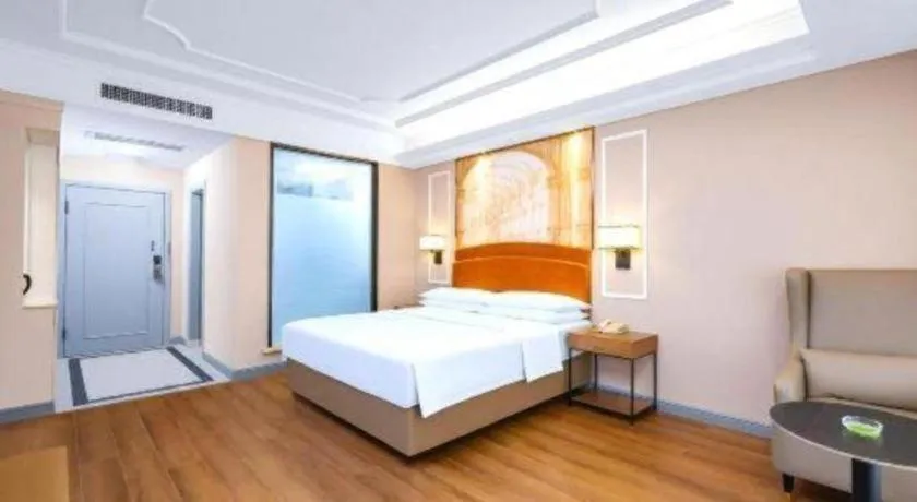 Bed in Vienna International Hotel Kunming Guangfu Road Aegean Shopping Center
