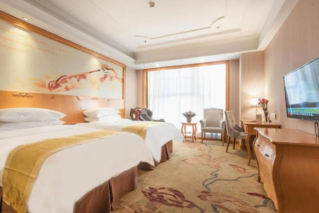 Bed in Vienna International Hotel Kunming Guangfu Road Aegean Shopping Center