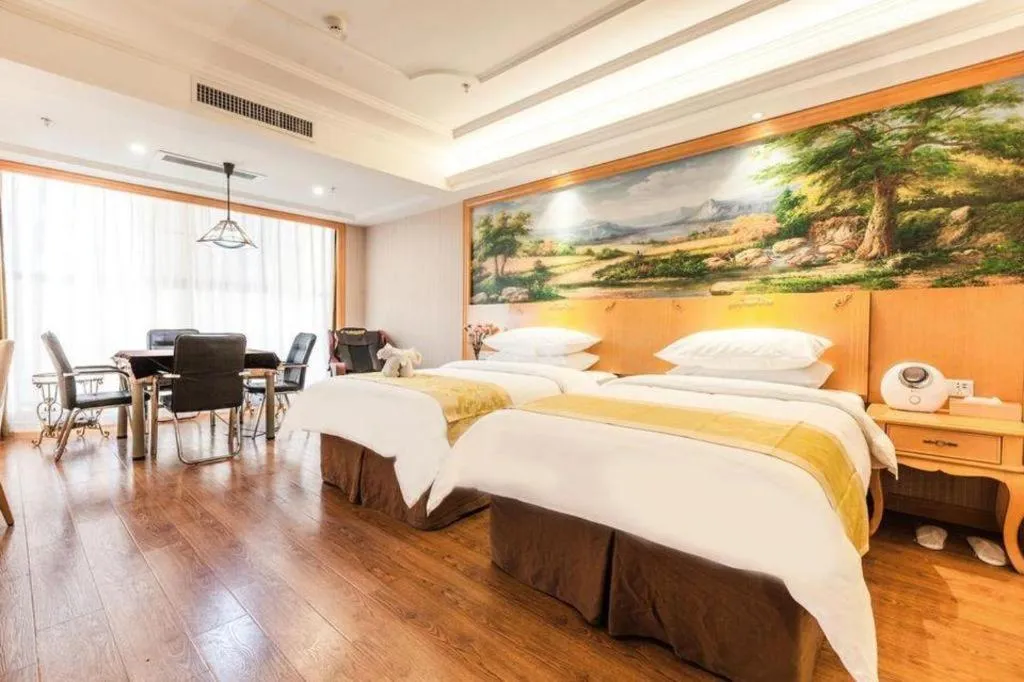 Bed in Vienna International Hotel Kunming Guangfu Road Aegean Shopping Center