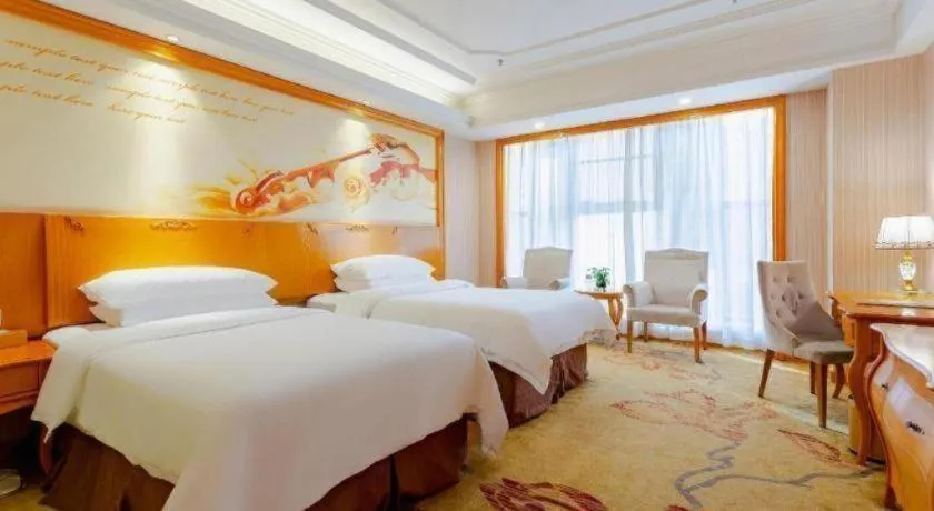 Bed in Vienna International Hotel Kunming Guangfu Road Aegean Shopping Center