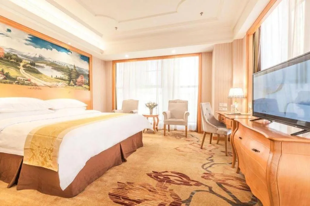 Bed in Vienna International Hotel Kunming Guangfu Road Aegean Shopping Center