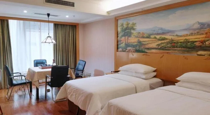 Bed in Vienna International Hotel Kunming Guangfu Road Aegean Shopping Center