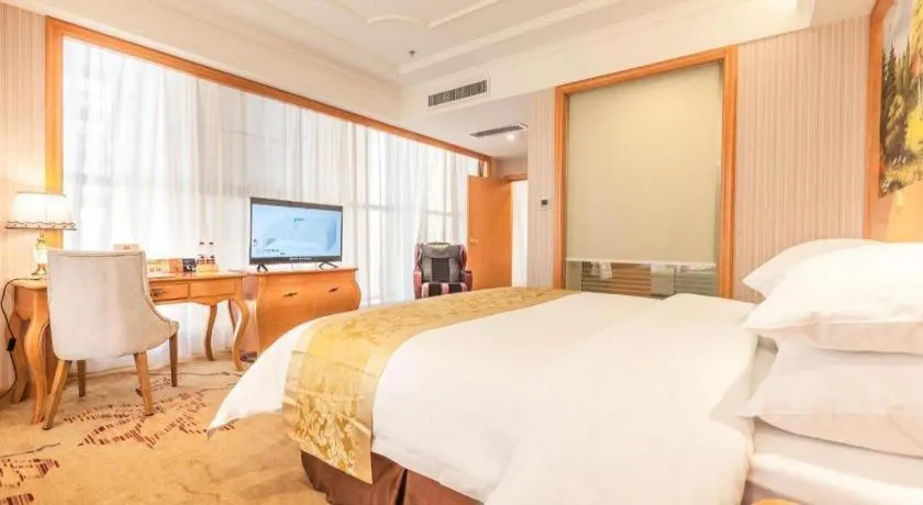 Bed in Vienna International Hotel Kunming Guangfu Road Aegean Shopping Center