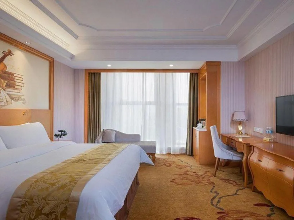 Bed in Vienna International Hotel Kunming Guangfu Road Aegean Shopping Center