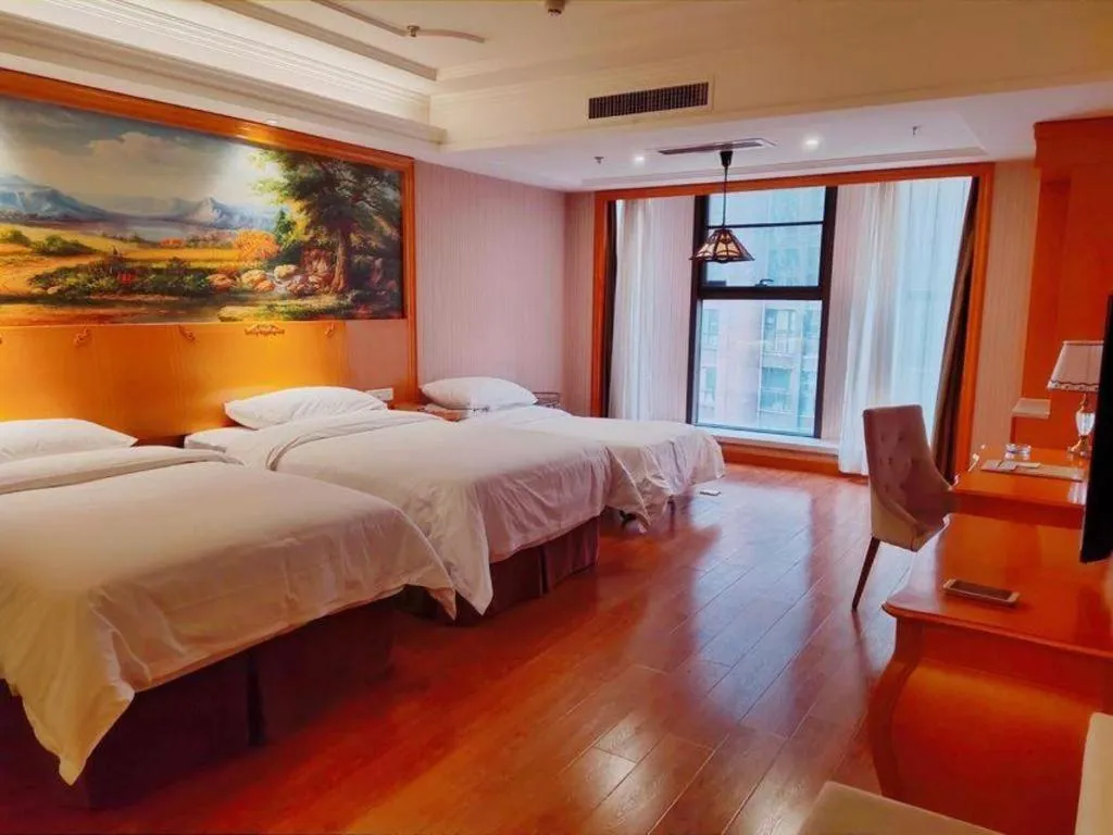 Bed in Vienna International Hotel Kunming Guangfu Road Aegean Shopping Center