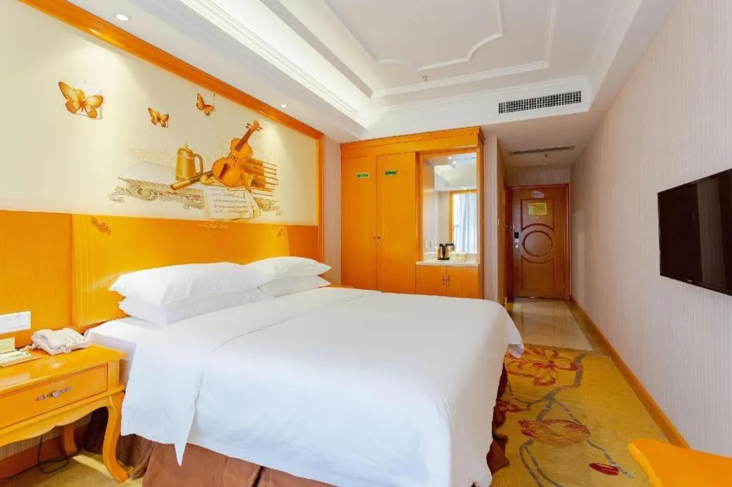 Bed in Vienna International Hotel Kunming Guangfu Road Aegean Shopping Center
