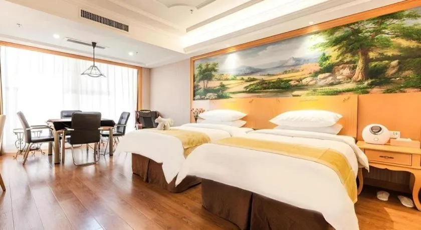 Bed in Vienna International Hotel Kunming Guangfu Road Aegean Shopping Center