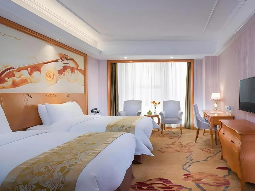 Bed in Vienna International Hotel Kunming Guangfu Road Aegean Shopping Center
