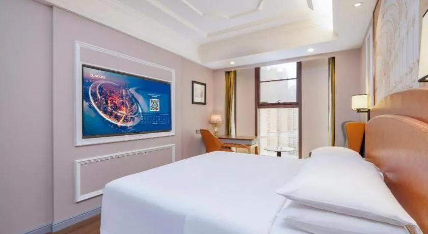 Bed in Vienna International Hotel Kunming Guangfu Road Aegean Shopping Center
