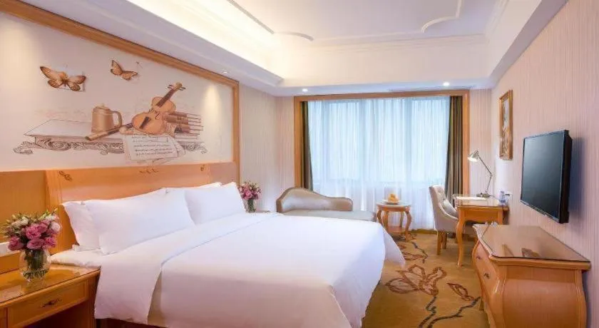 Bed in Vienna International Hotel Kunming Guangfu Road Aegean Shopping Center