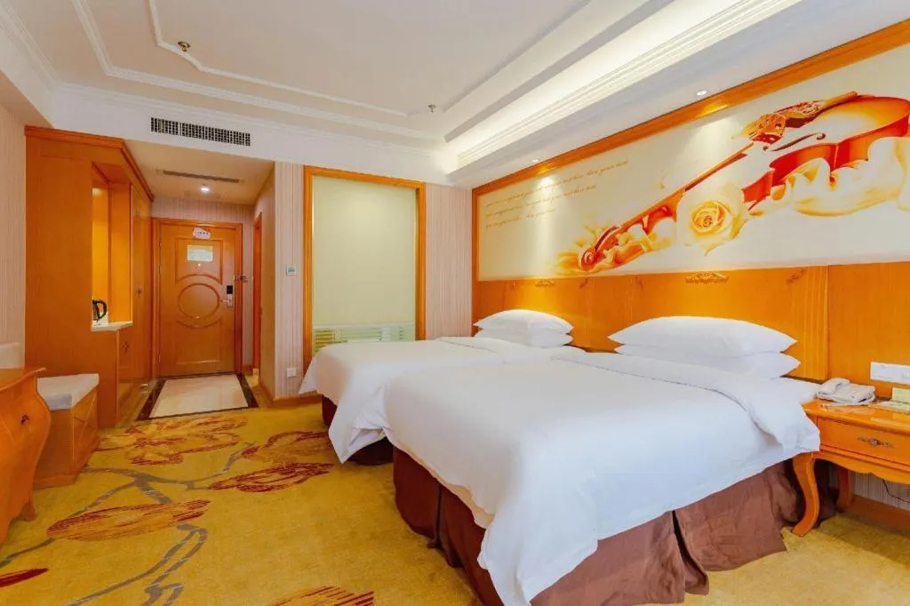 Bed in Vienna International Hotel Kunming Guangfu Road Aegean Shopping Center