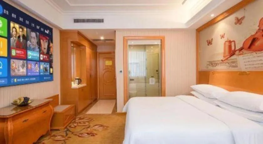 Bed in Vienna Hotel Guangzhou Airport Gaosu Pingsha