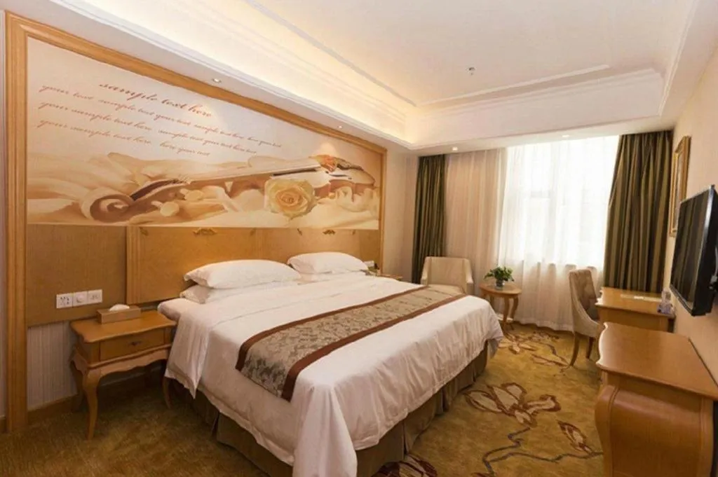 Bed in Vienna Hotel Guangzhou Airport Gaosu Pingsha