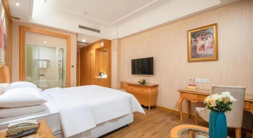Bed in Vienna Hotel Guangzhou Airport Gaosu Pingsha