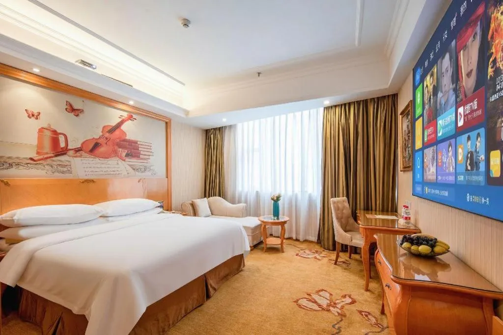 Bed in Vienna Hotel Guangzhou Airport Gaosu Pingsha