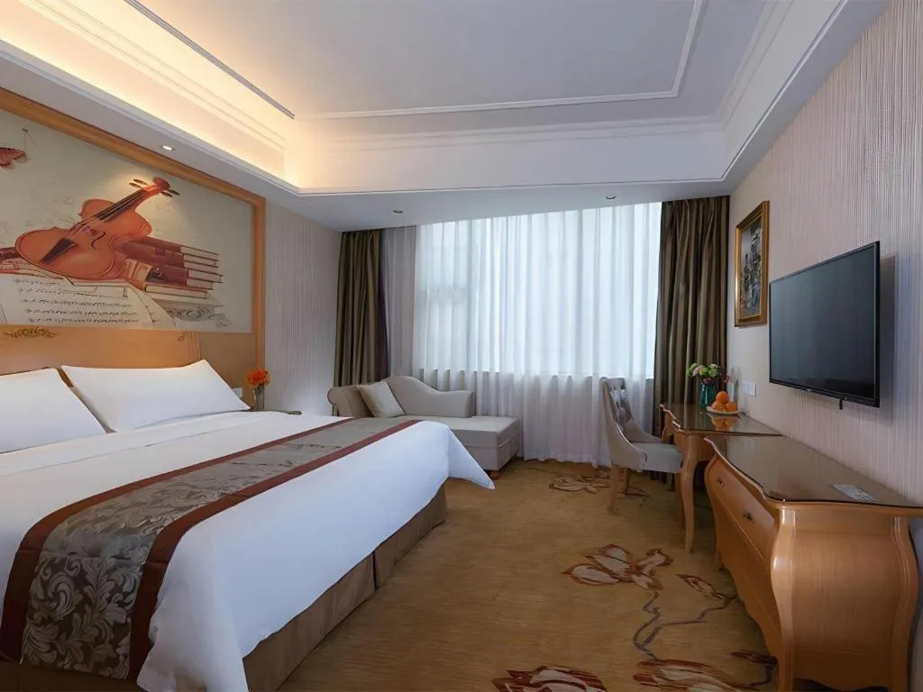 Bed in Vienna Hotel Guangzhou Airport Gaosu Pingsha