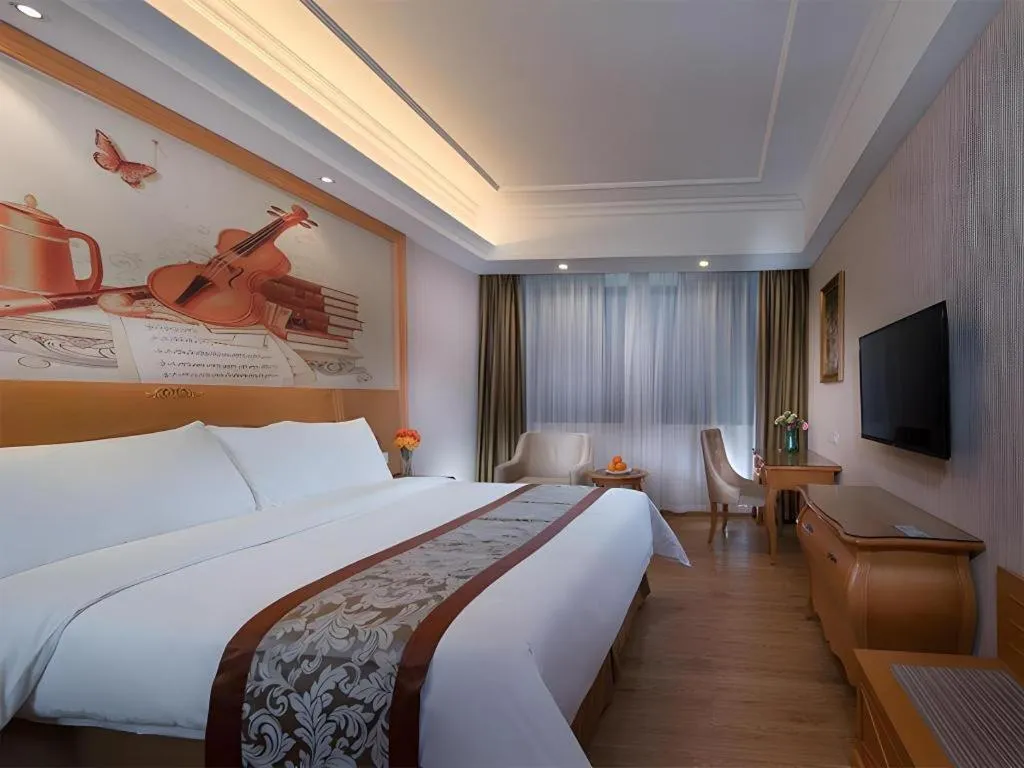 Bed in Vienna Hotel Guangzhou Airport Gaosu Pingsha