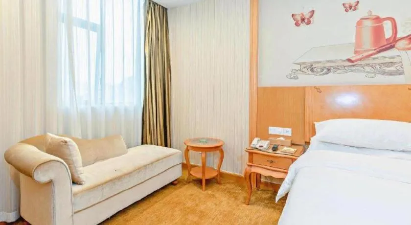 Bed in Vienna Hotel Guangzhou Airport Gaosu Pingsha