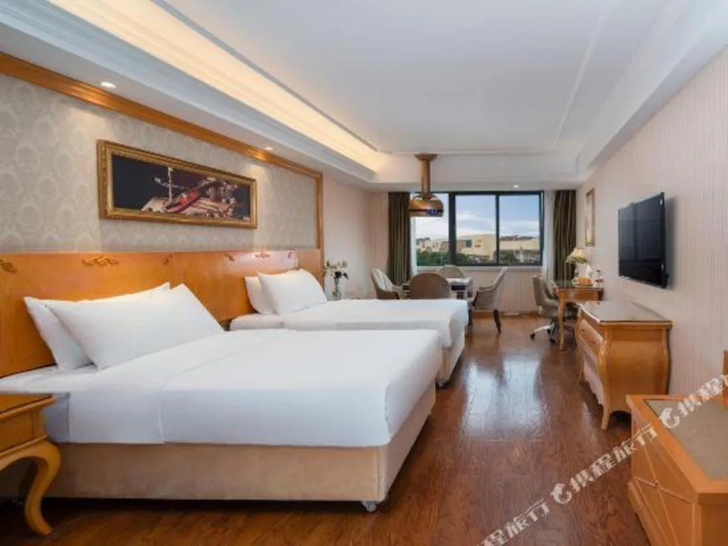 Bed in Vienna Hotel Chengdu Airport Shuangliu Wanda