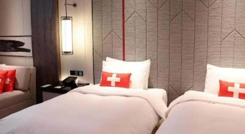 Bed in Swisstouches Hotel Ankang