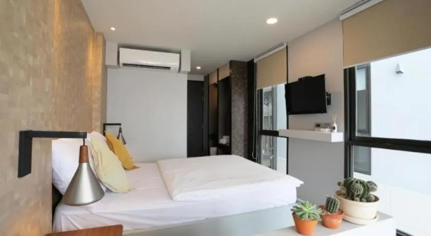 Bed in The River House Chiangkhan Hotel