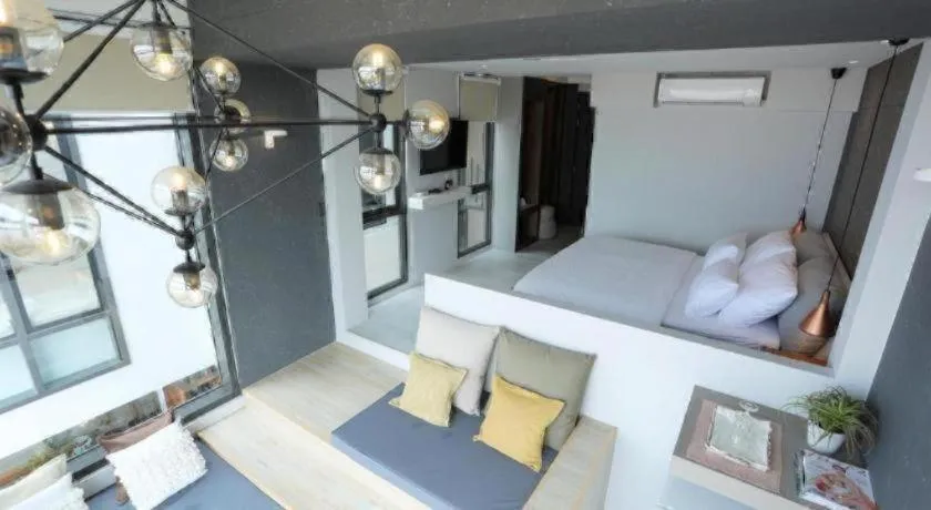 Bed in The River House Chiangkhan Hotel