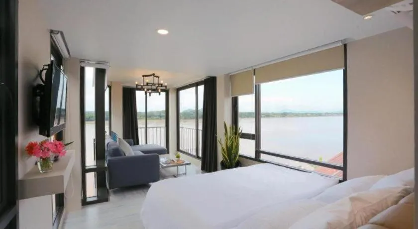 Bed in The River House Chiangkhan Hotel