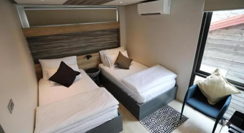 Bed in The River House Chiangkhan Hotel