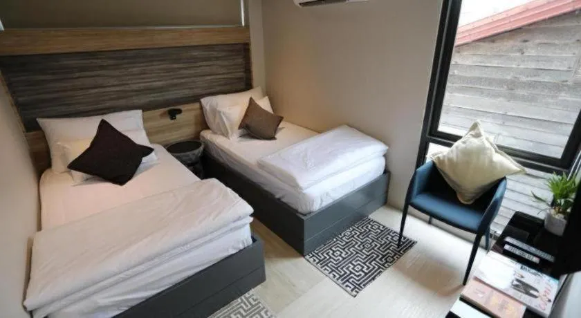 Bed in The River House Chiangkhan Hotel