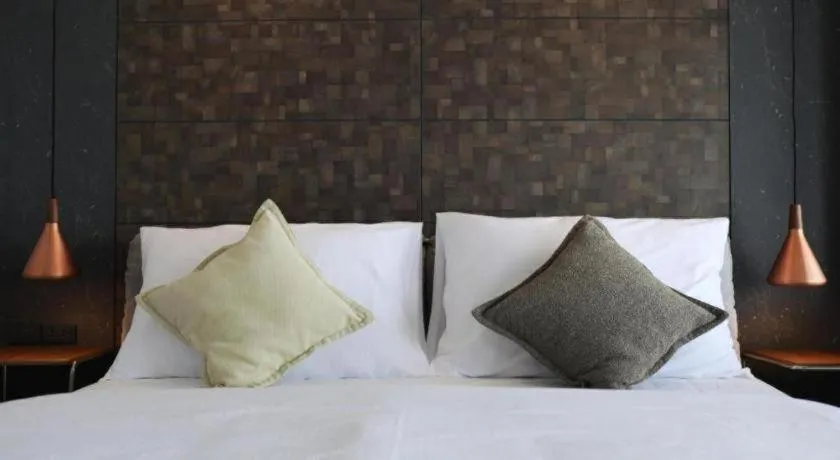 Bed in The River House Chiangkhan Hotel